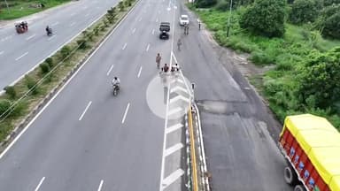 अमरोहा: अमरोहा में नेशनल हाइवे नौ पर पुलिस ड्रोन से कावड़ यात्रा पर रख रही है नजर