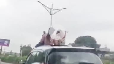 देहरादून: देहरादून RTO चेक पोस्ट के सामने हरियाणा नंबर की गाड़ी ने तोड़े नियम, दो युवतियां गाड़ी की छत पर बैठकर बना रही थीं रील