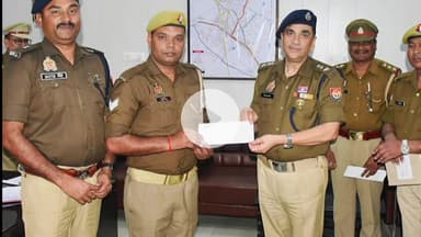 रामपुर: एसपी विद्यासागर मिश्र ने पुलिस कार्यालय में अच्छा कार्य करने वाली महिला आरक्षी और पुरुष कांस्टेबल को चेक दिया