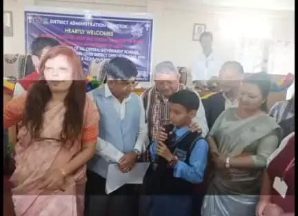 Union MoS Dr. Subhas Sarkar interacting  with a student on the mid day meal provided at school in Gangtok today- part1