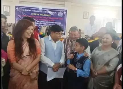 Union MoS Dr. Subhas Sarkar interacting  with a student on the mid day meal provided at school in Gangtok today- part2