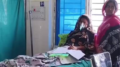 কান্দি: কান্দি মহকুমা হাসপাতালে অক্সিজেন মাস্ক মুখে নিয়েই পরীক্ষা দিচ্ছে ছাত্রী