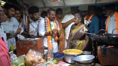 அவிநாசி: சேவூரில் மத்திய இணை அமைச்சர் எல். முருகன் போண்டா சுட்டு கொடுத்து வாக்கு சேகரிப்பில் ஈடுபட்டார்