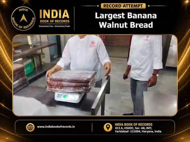 Largest Banana Walnut Bread
A massive 30-ft-long and 200-kg banana walnut bread was created at JECRC University, Jaipur, by chefs, faculty members, and students of the School of Hospitality. The giant bread was later shared with underprivileged children through the ‘Zarurat’ initiative, blending culinary excellence with a meaningful social cause.
#IndiaBookOfRecords #BananaWalnutBread #JECRCUniversity #FoodRecord #Jaipur #CulinaryExcellence