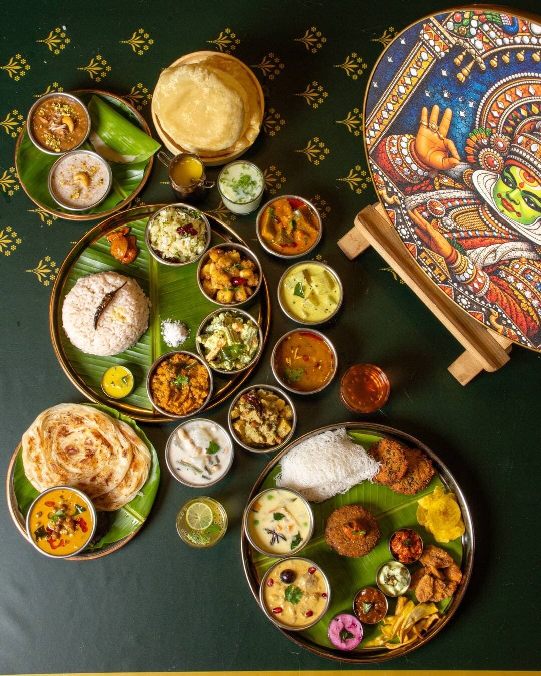 ₹671 for one of the most generous Onam Sadyas you'll find in Bengaluru this season — and it's right here in Gandhi Bazaar.
Every year, Onam is a homecoming. King Mahabali returns from the netherworld to see his people, and his people lay out the finest spread they can — as proof that his golden age still lives on.
At Atithyaa, a place that has been feeding Bengaluru since 1986, that spirit lands differently. There's something fitting about a restaurant rooted in tradition being the one to tell this story on a leaf.
What you're looking at — the avial, erissery, olan, kalan, thoran, rasam, sambar, pachadi, the appam, the idiyappam, the pradhaman — isn't just a menu. It's a meal designed around Ayurvedic balance, where every taste from sweet to astringent has its place and its moment. Rice at the centre. Ghee to open it. Moru to close it. The Kathakali fan watching over the whole thing.
When most Onam Sadyas in the city are asking ₹2000 and above, Atithyaa is doing it for ₹671. You don't have to pay a bomb to eat like Mahabali's people.
That's the whole point of the festival, isn't it.
Available on 23 - 25 th of August and please call the restaurant for reservations or DM them on Instagram
📍 @atithyaa_hotel, Gandhi Bazaar
#OnamSadya #BengaluruFoodie #OnamInBengaluru #AtithyaaHotel #OnamSadyaBengaluru