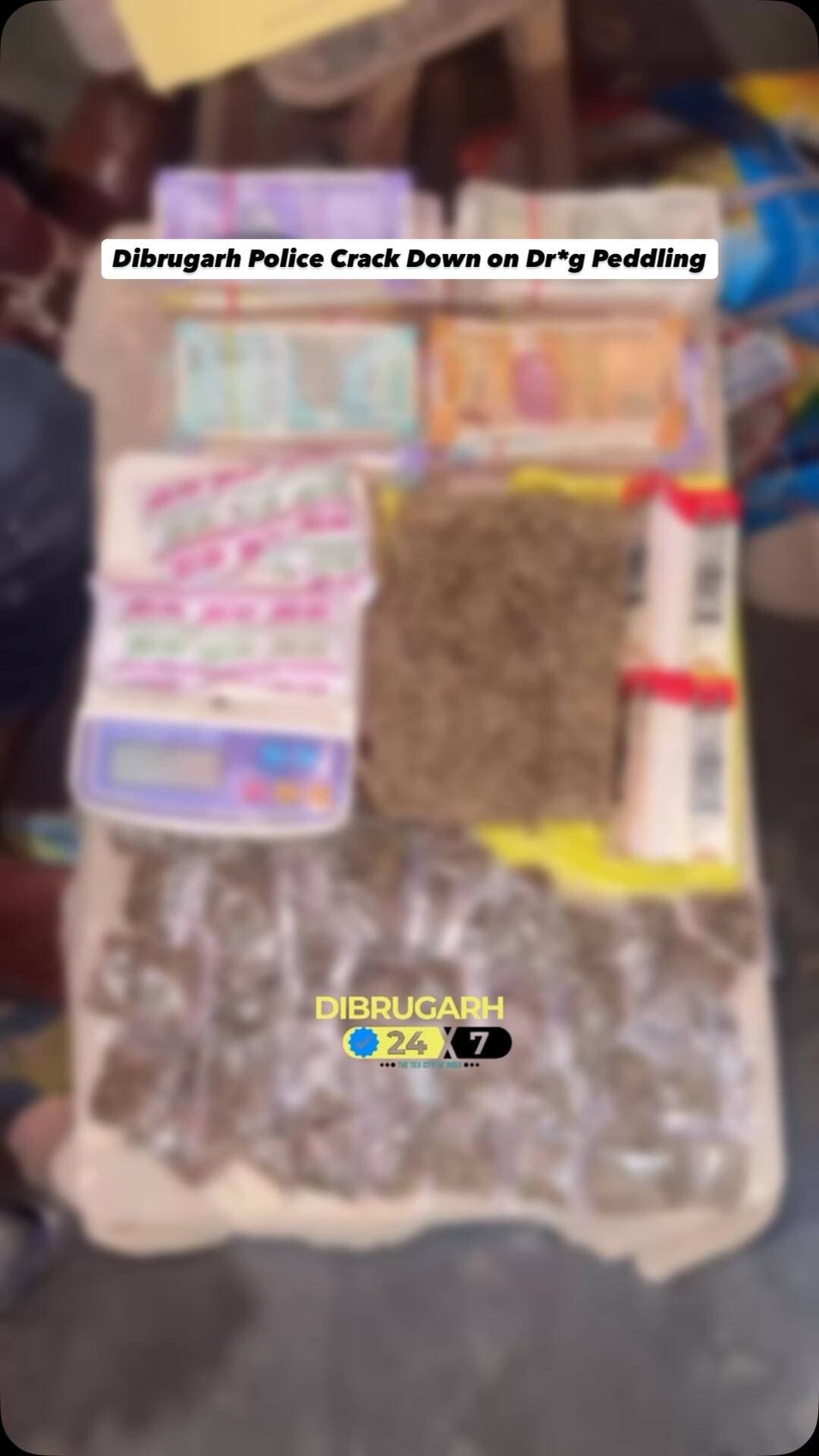 #Assam | In a swift late-night operation, Dibrugarh Police conducted a raid at Jokai Chabbis Gharia Gaon, Barbaruah and apprehended a suspected habitual dr*g peddler allegedly involved in the ill*gal distribution of drugs in the area.
During the oper*tion, police recovered 966 grams of suspected g@nja along with ₹1,44,270 in cash, believed to be proceeds from dr*g sales. Officers also seized a mobile phone, a digital weighing machine, zip-lock packaging materials and other articles allegedly linked to the suspected dr*g distribution network.
The oper@tion was carried out under the leadership of CDSP Khowang Amit Ranjan Barman, as part of ongoing efforts by Assam Police to curb the illeg@l dr*g trade in the region.