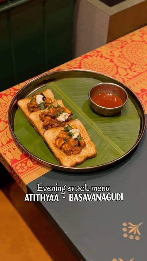Basavanagudi just got its perfect evening ritual.
@atithyaa_hotel is now serving evening snacks, and this menu is everything your 5pm self has been waiting for.
We’re talking Duet Idly — button ellu podi idly and ghee podi idly with 3 chutneys. Because one was never enough.
Then there’s the Millet Pumpkin Nuchununde — ragi sevai, grated pumpkin, darshini chutney. The kind of snack that feels both nostalgic and quietly wholesome.
The Chettinad Masala Paniyaram brings the heat — 5 pieces, red chutney, full flavour. And if you’re feeling a little colonial-era curious, the Railway Cutlet is a special oval cutlet straight from Anglo-Tamil cuisine. Three pieces of pure history on a plate.
Kothu Idyappam with raitha. Paneer Sukka Toast. Thiranga Uthappam — Each a star in its own way !
Pair any of this with a filter coffee or masala chai and tell me you’re not sorted for the evening. I dare you.
📍 Atithyaa, Basavanagudi | Since 1986 | Now serving evening snacks
#vinaysathyam #bengaluru #bangalorebreakfastwalks #gandhibazaar #basavanagudi