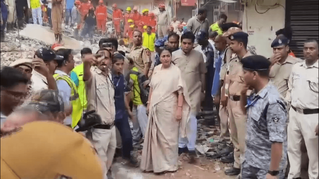 Delhi CM Rekha Gupta arrives at the site of the building collapse in Satya Niketan.