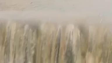 తుఫాను కారణంగా పాడేరు కొత్తవలస వద్ద వర్షపు నీటితో జలపాతాలను తలపించిన పంట పొలాలు