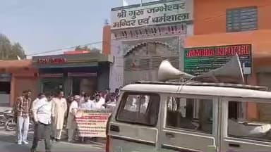 रायसिंहनगर: रायसिंहनगर में बिश्नोई मंदिर सभा अध्यक्ष पद को लेकर विवाद, एक पक्ष ने मिनी सचिवालय पर किया धरना प्रदर्शन