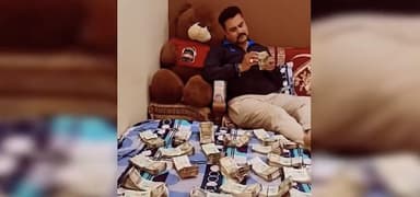 उज्जैन में बिस्तर पर नोटों की गड्डियां बिछाकर होमगार्ड के जवान ने बनाई रील, वायरल होने के बाद जांच शुरू #होमगार्ड